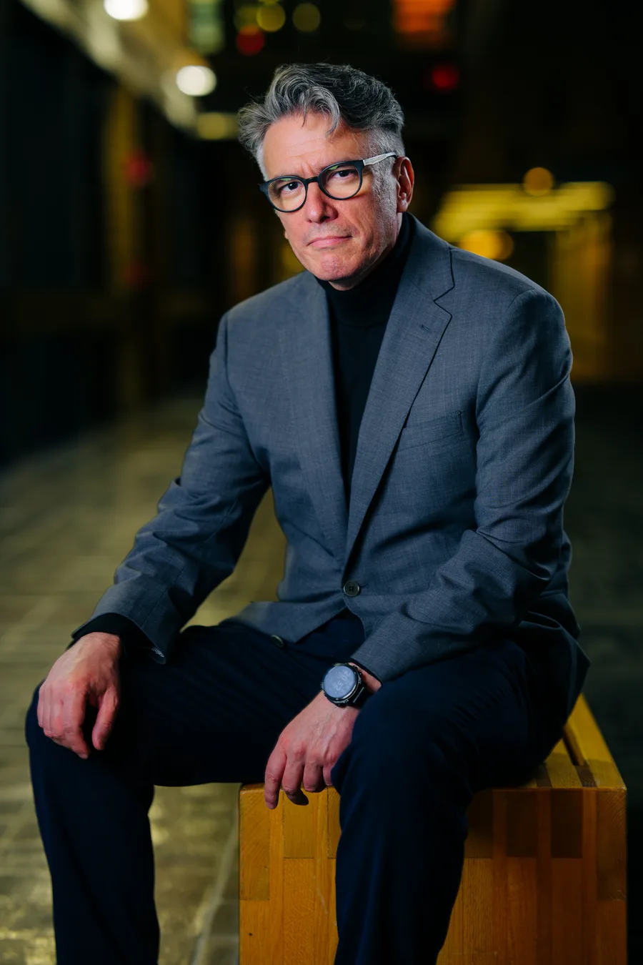 Felipe Csaszar seated in a gray jacket and black turtleneck